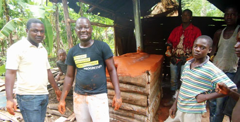 Gabriel Petit-Homme in front of eco stove