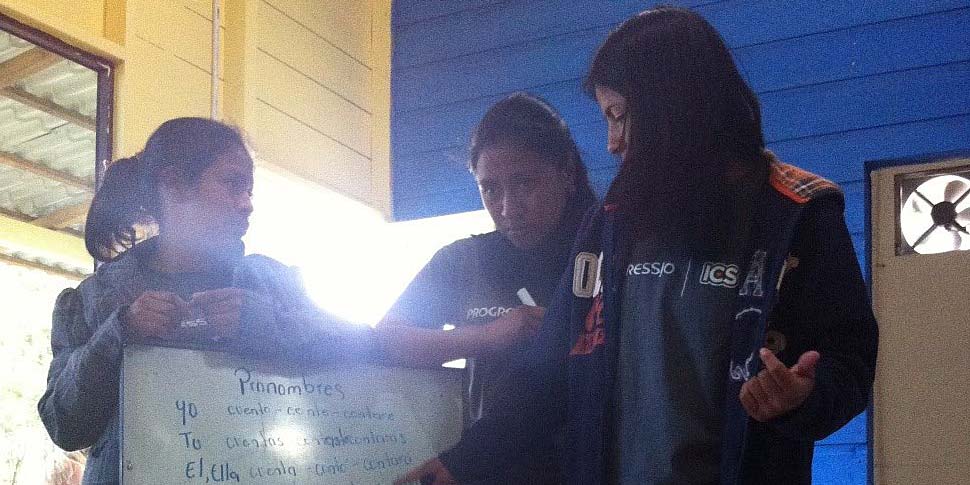 Honduran volunteers teaching UK volunteers Spanish