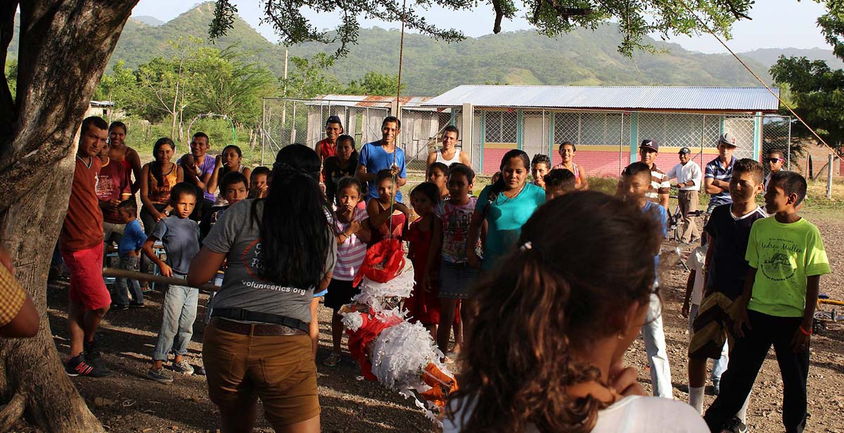 A game of piñata in the community