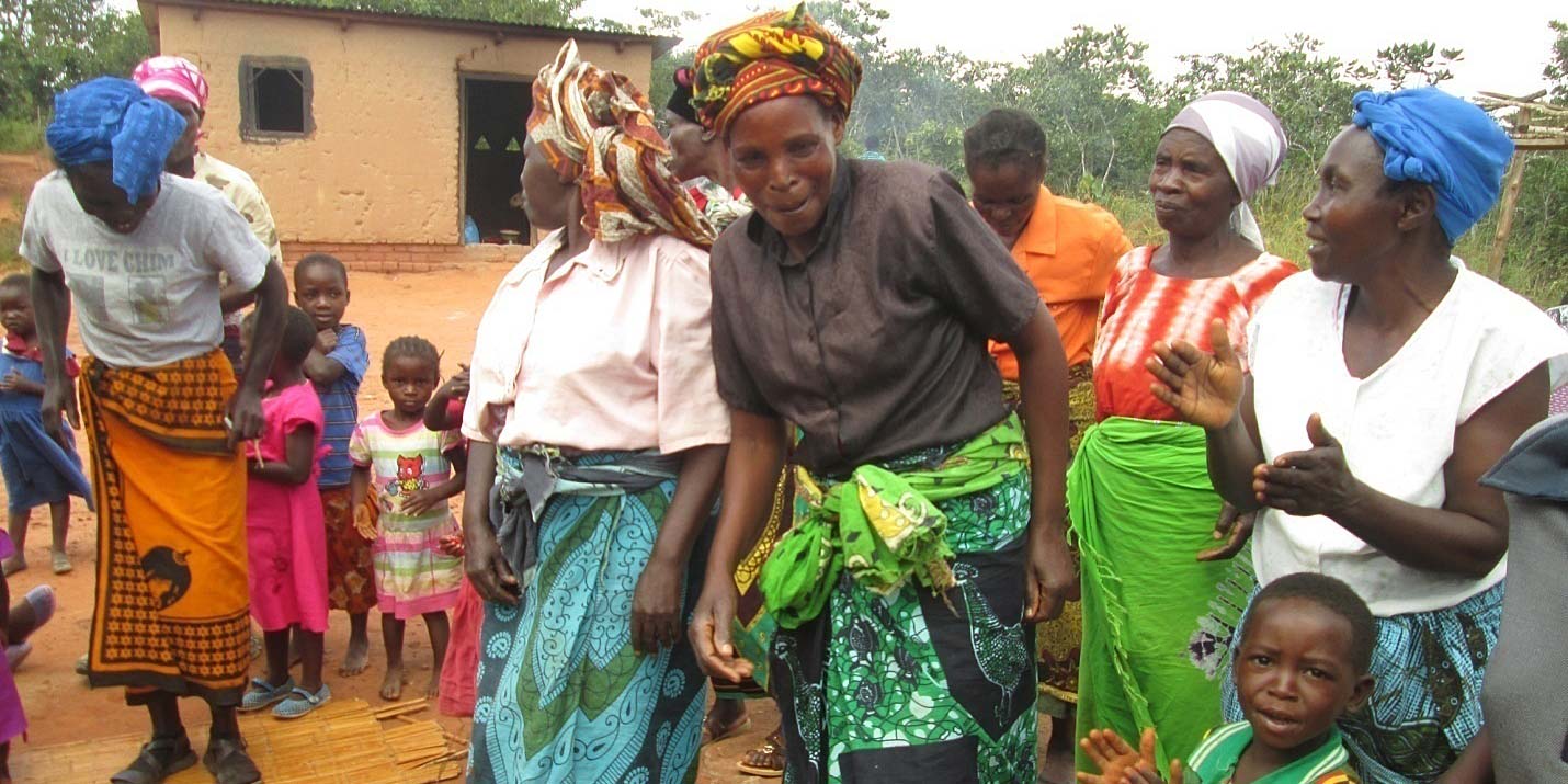 Some of the clay cook stove beneficiaries dance in delight