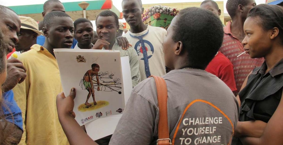 Patricia conducting a peer education session with bicycle taxi operators