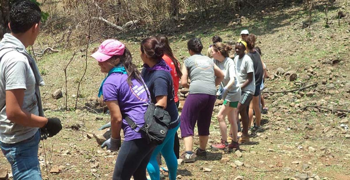 Volunteers collecting rocks for their eco-construction