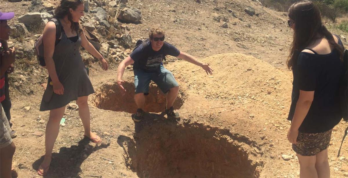  Team leader John shares his favourite squatting position at newly dug latrine pits in Terera, Mutasa district