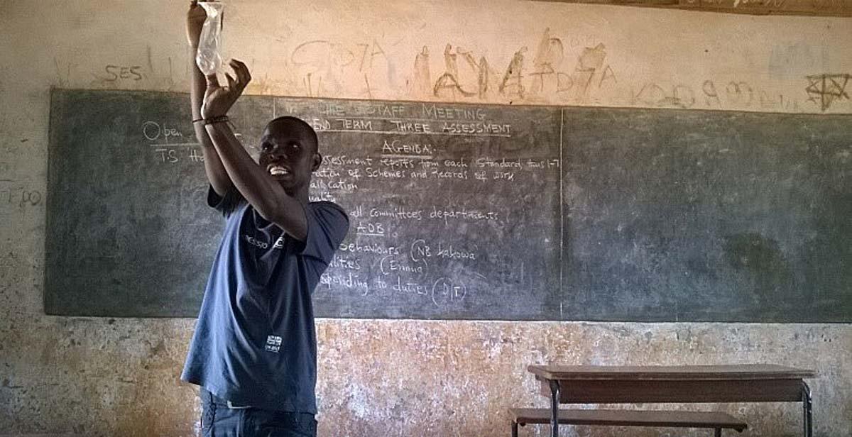 National volunteer facilitating a condom demonstration