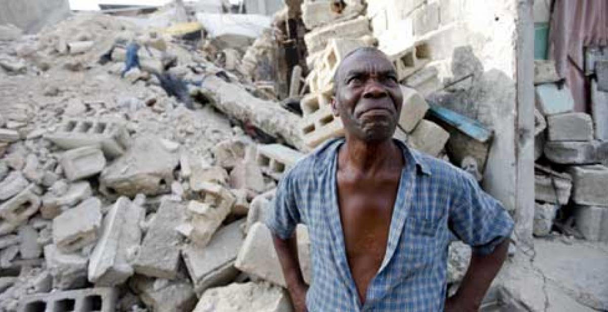 Wilbert Joseph surveys the rubble of his former home
