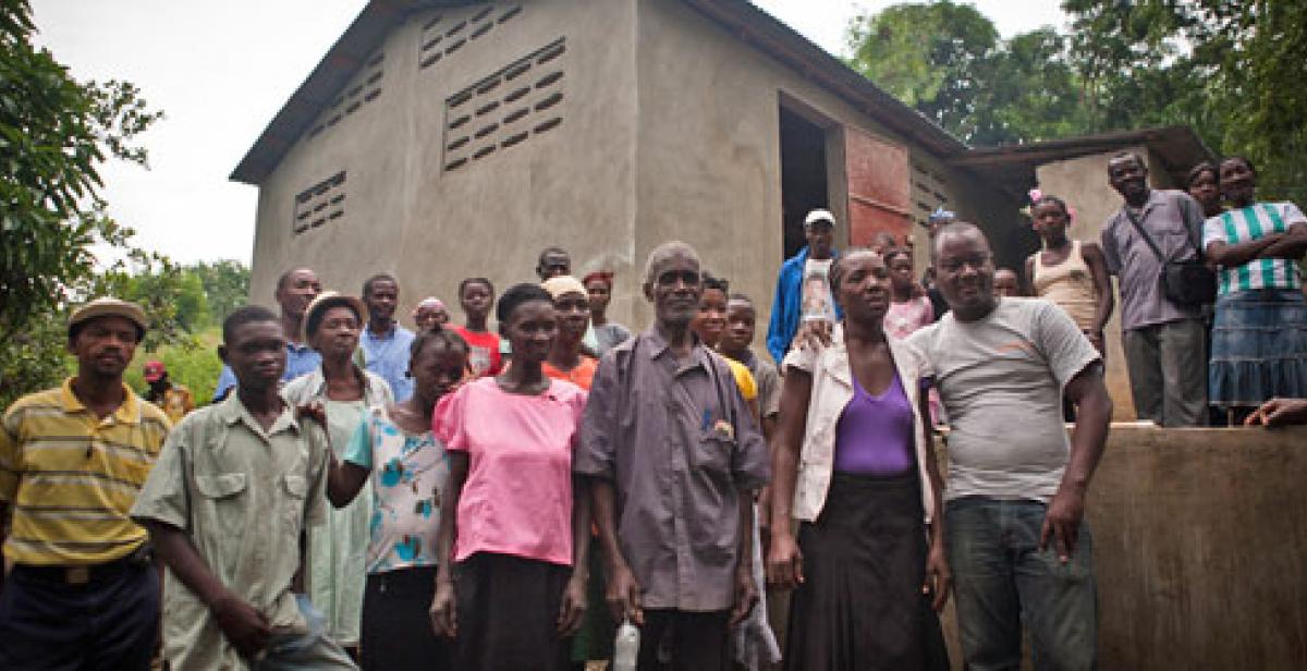 Villagers outside cassava factory in Gens de Nantes