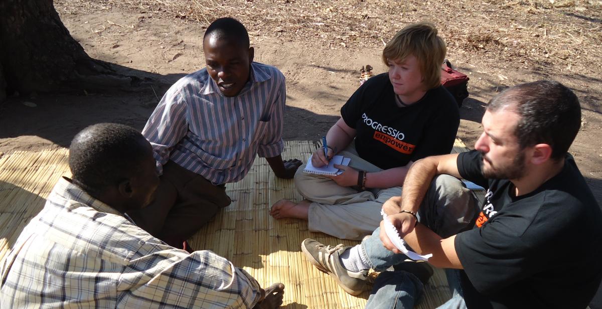 ICS volunteers talking with Malawian people