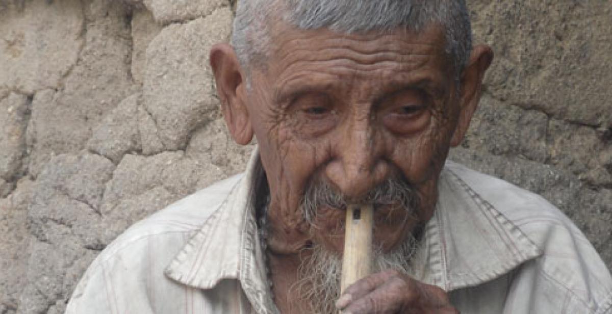 Don Marcelino Galicia playing the recorder