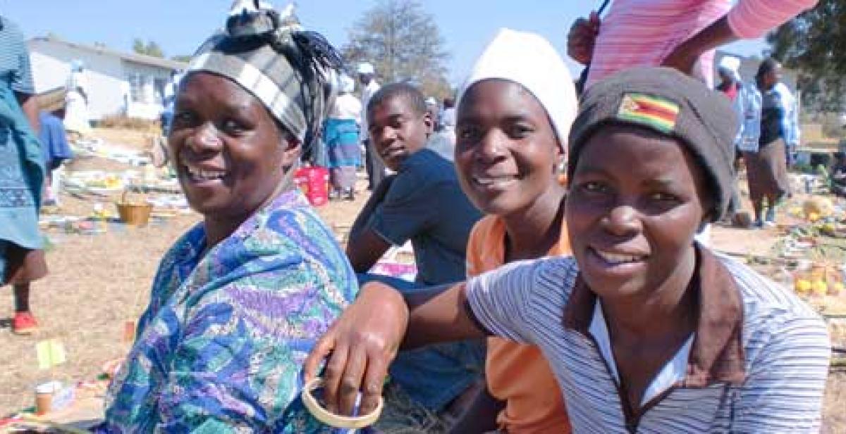 A group of farmers smile for the camera