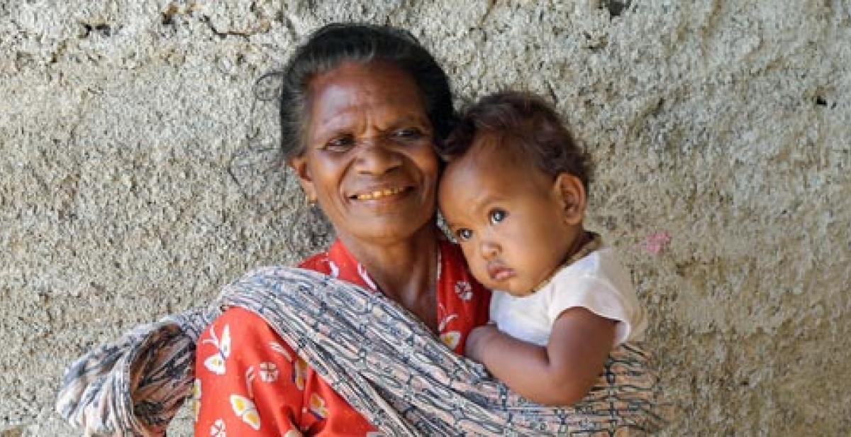 Rosa Dos Santos, 63, with grandchild in Timor-Leste