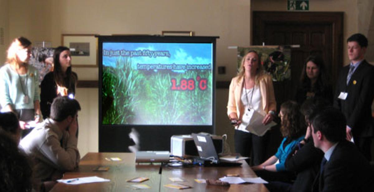 ICS volunteers doing a presentation in Parliament