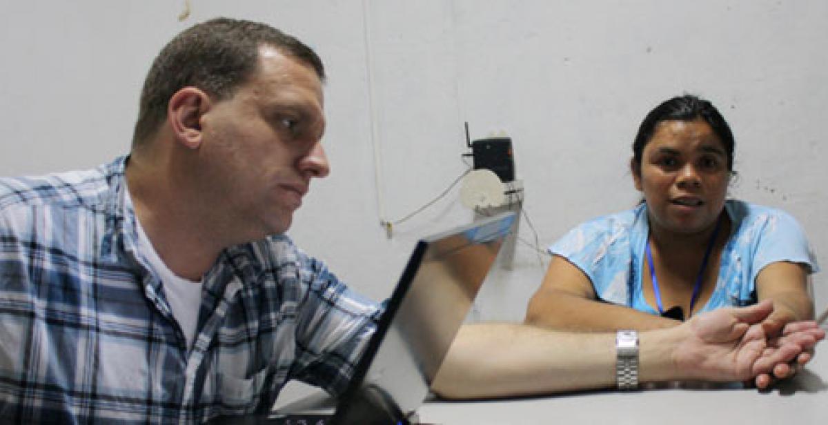 Jim Matarazzo with woman interviewee in El Salvador