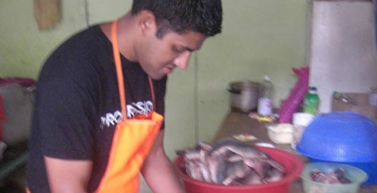 Monju Meah helping at a soup kitchen