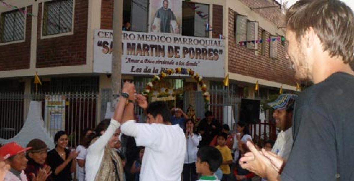 People dancing to celebrate the anniversary of the health clinic