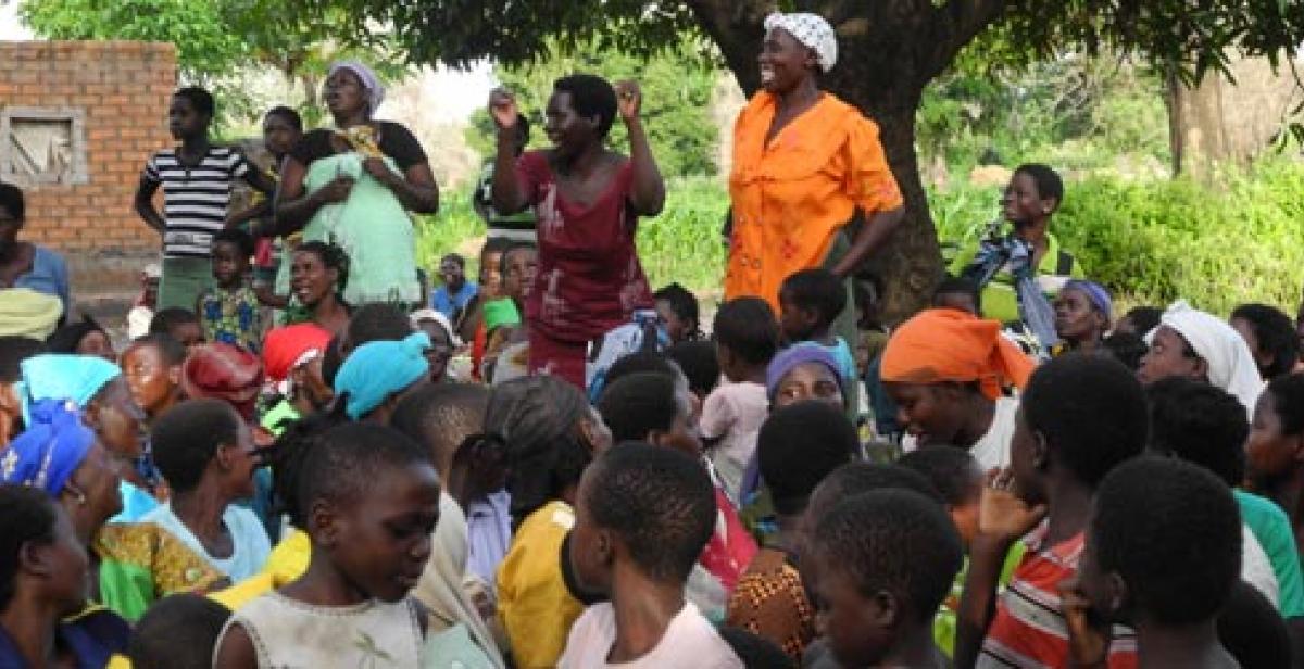 Women and children celebrate tree planting