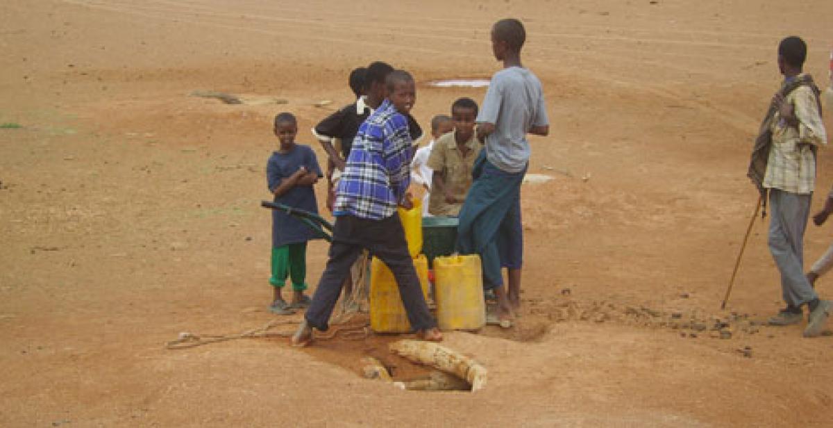 Somaliland: Boys collecting water at water hole