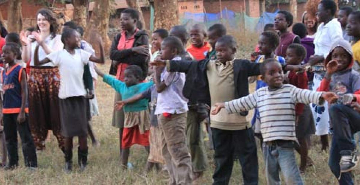 Volunteers playing bulldog with local children