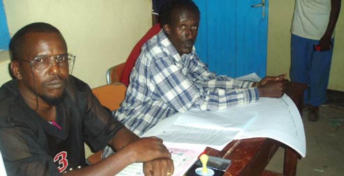 A polling station chairman awaits voters at the 2005 elections