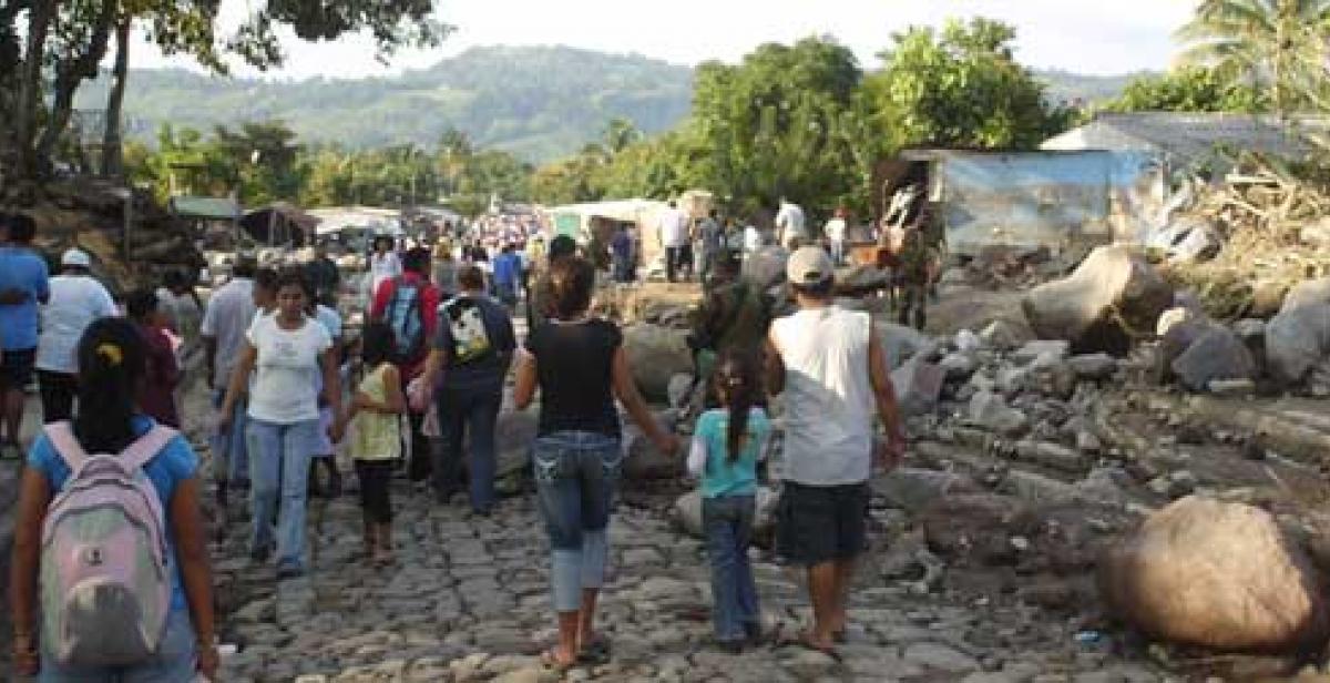 people walking amongst rocks and bolders