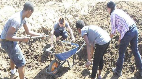 Digging a community fish pond