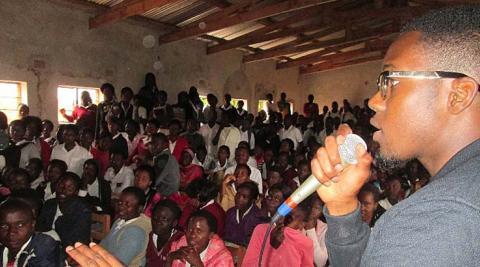  ICS volunteer Kadir keeping the crowd captivated by leading a game of Simon Says