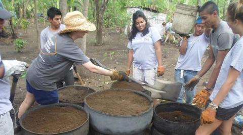 Volunteers building vegetable patches