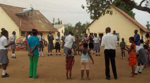 Visiting school children play games with the orphans at Mushawevana 