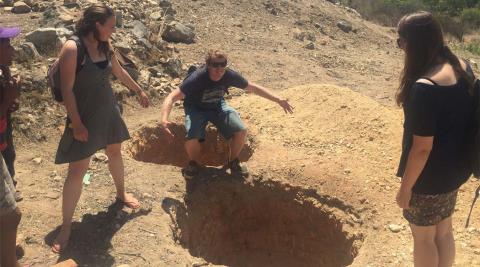  Team leader John shares his favourite squatting position at newly dug latrine pits in Terera, Mutasa district