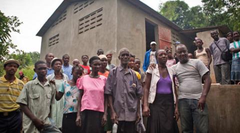 Villagers outside cassava factory in Gens de Nantes