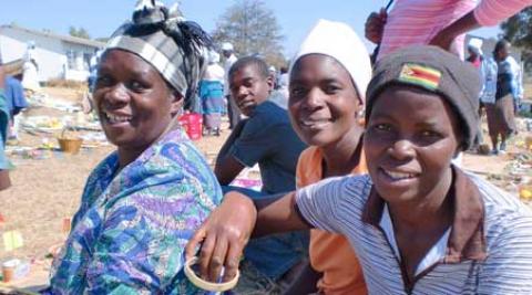 A group of farmers smile for the camera