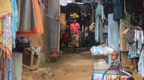 Woman and baby in clothes market