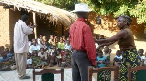 Children in Malawi village watch drama about HIV