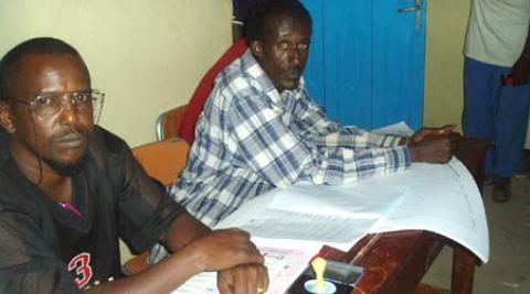 A polling station chairman awaits voters at the 2005 elections