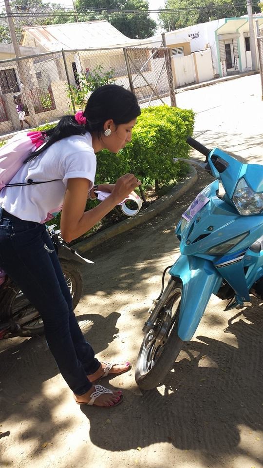 Yunelsi preparing her field visit with her motorbike